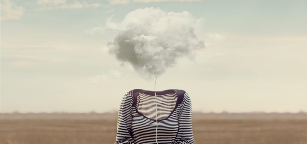 Woman holding cloud on string in place of head