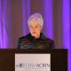 Mary Lou Smith, JD at podium