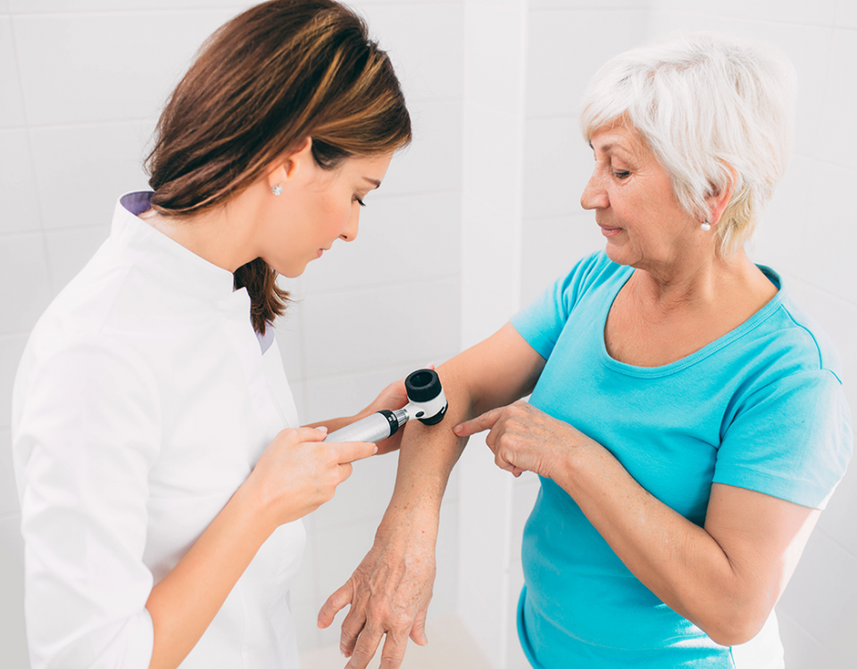 Doctor performing skin exam