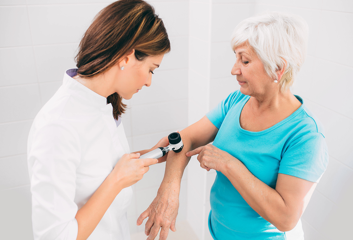 Doctor performing skin exam