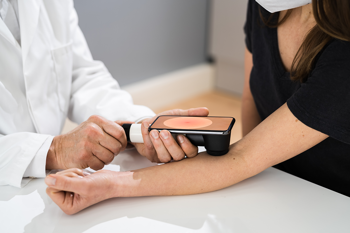 Doctor performing skin exam