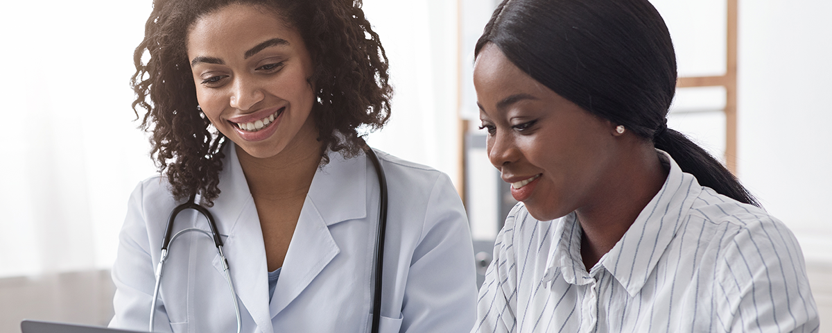 Doctor and patient on laptop