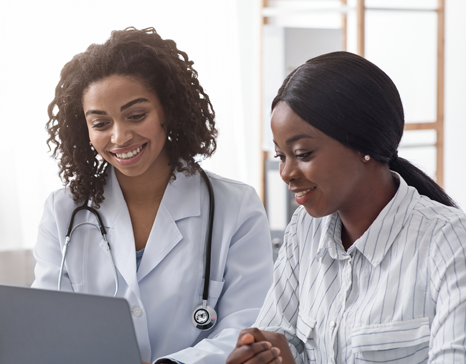 Doctor and patient on laptop