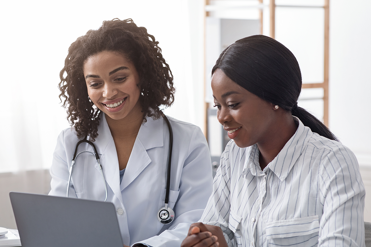 Doctor and patient on laptop