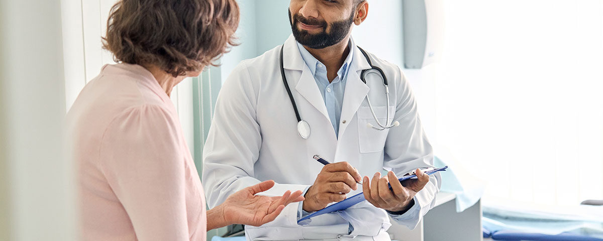 Patient and doctor speaking in exam room