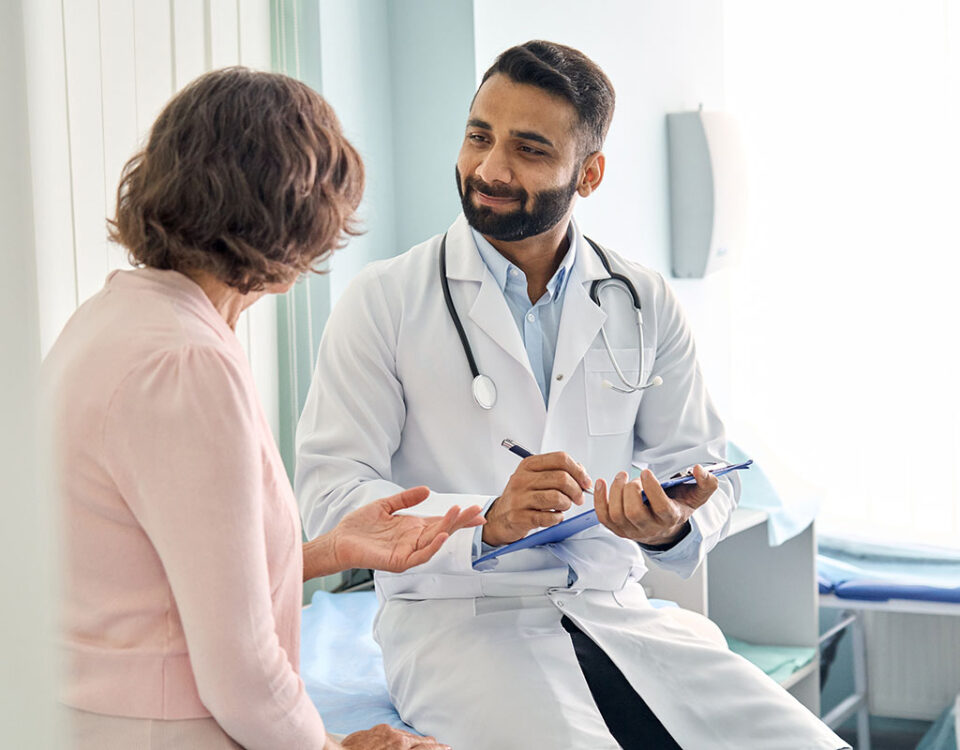 Patient and doctor speaking in exam room