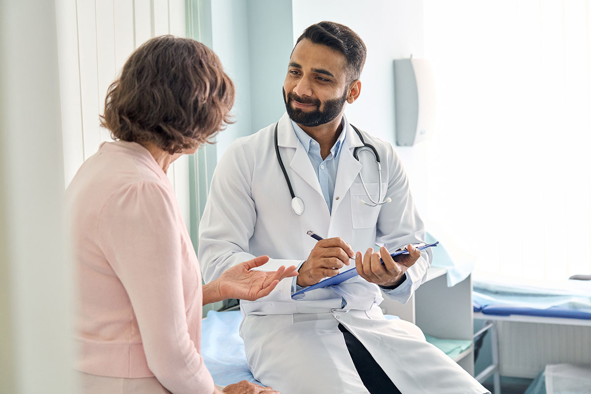 Patient and doctor speaking in exam room