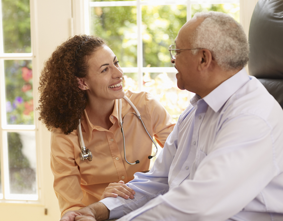 Doctor talking with older male patient